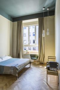 Postel nebo postele na pokoji v ubytování casaBASE