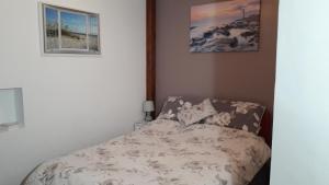 Ein Bett oder Betten in einem Zimmer der Unterkunft The Anchorage