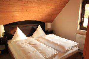 
Ein Bett oder Betten in einem Zimmer der Unterkunft Pension Jokusch
