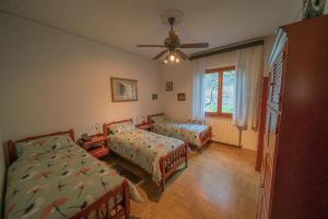 Posteľ alebo postele v izbe v ubytovaní VILLA IL TRUFOLO