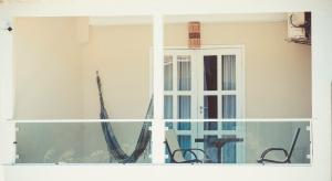 a view of a window of a house at Pousada Mareia in Morro de São Paulo