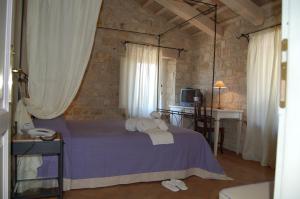 Postel nebo postele na pokoji v ubytování Valcastagno Relais & Residence