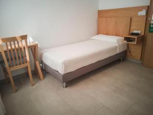 Postel nebo postele na pokoji v ubytování Hotel Abadi