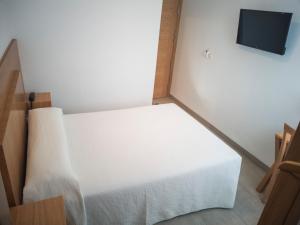 Postel nebo postele na pokoji v ubytování Hotel Abadi