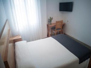 Postel nebo postele na pokoji v ubytování Hotel Abadi