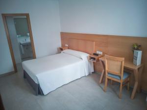 Postel nebo postele na pokoji v ubytování Hotel Abadi
