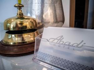 Postel nebo postele na pokoji v ubytování Hotel Abadi
