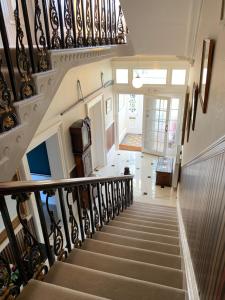a staircase leading up to a stair case at Aberley House in Liverpool