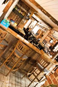 a bar with wooden stools in a restaurant at The Rising Sun Inn in Waterlooville