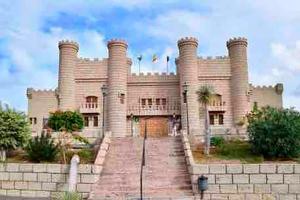 a large brick building with stairs in front of it at Bed & Breakfast Tenerife in San Miguel de Abona