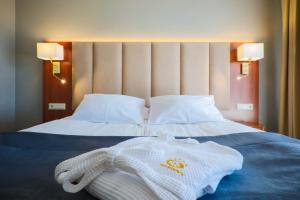 Postel nebo postele na pokoji v ubytování Hotel Belweder