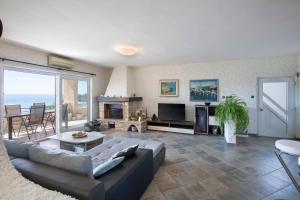 a living room with a couch and a fireplace at Horizont view apartment in Pula