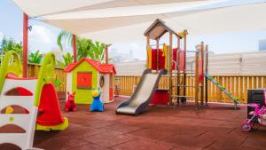 a playground with different types of play equipment at Silver Sea Holiday Apartments in Ayia Napa