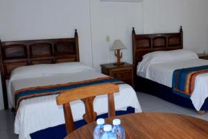 Postel nebo postele na pokoji v ubytování Hotel Mayto