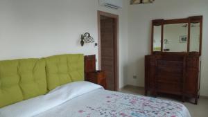 Postel nebo postele na pokoji v ubytování Agriturismo Cascina Poscallone