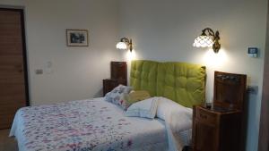 Postel nebo postele na pokoji v ubytování Agriturismo Cascina Poscallone