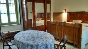 Postel nebo postele na pokoji v ubytování Agriturismo Cascina Poscallone