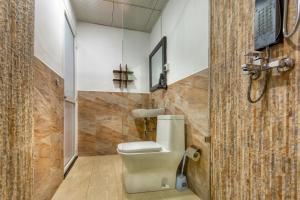 a bathroom with a toilet and a shower at L&D Stay Inn in Hikkaduwa
