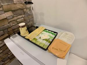 a tray of food sitting on top of a refrigerator at Chill Place in Zhudong