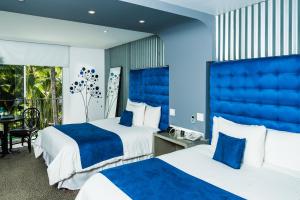 Ein Bett oder Betten in einem Zimmer der Unterkunft Riande Aeropuerto Hotel Casino