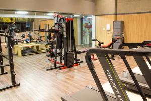 a gym with several treadmills and exercise bikes at Slaviero Campina Grande in Campina Grande
