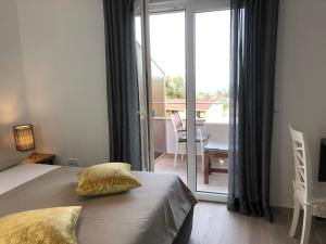 Posteľ alebo postele v izbe v ubytovaní Apartments Villa Učka