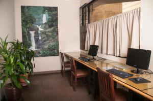 Uma TV ou centro de entretenimento em Hotel Ferrua