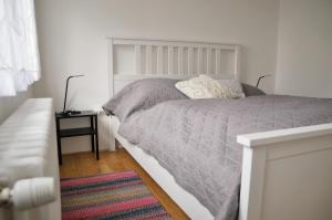 A bed or beds in a room at Ubytování v Klánovicích - Forest Garden