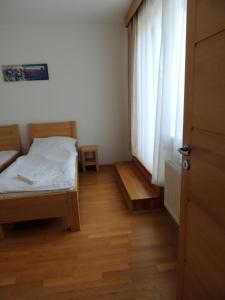 Postel nebo postele na pokoji v ubytování Rezidence & Wellness Blatov