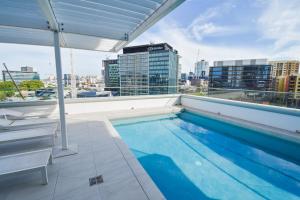 a swimming pool on the roof of a building at Belise Apartments in Brisbane
