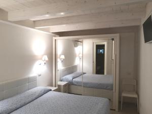 Een bed of bedden in een kamer bij Dimora Del Mar