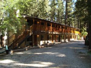 a large building with a porch and a balcony at Goldmine Lodge in Big Bear Lake