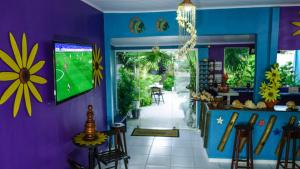 Televisyen dan/atau pusat hiburan di Pousada Girassol +19 gambar
