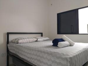 A bed or beds in a room at Premium Loft Lorena