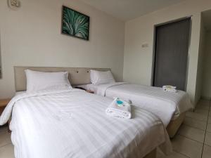 Postel nebo postele na pokoji v ubytování De Ocean Hotel