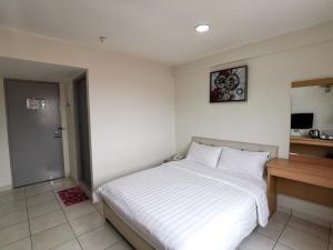 Postel nebo postele na pokoji v ubytování De Ocean Hotel