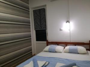 Postel nebo postele na pokoji v ubytování Miron apart&rooms