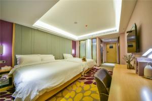 Ένα ή περισσότερα κρεβάτια σε δωμάτιο στο Lavande Hotel Dali Erhai Park Branch +13 φωτογραφίες