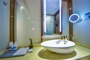 a bathroom with a large white sink on a counter at Lavande Hotel Dali Erhai Park Branch in Dali