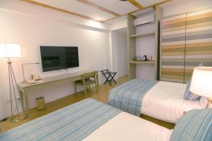 Voodi või voodid majutusasutuse Thunderbird Resorts - Rizal toas