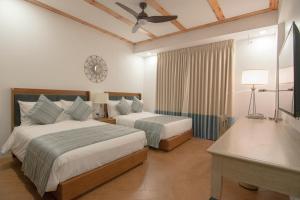 Voodi või voodid majutusasutuse Thunderbird Resorts - Rizal toas