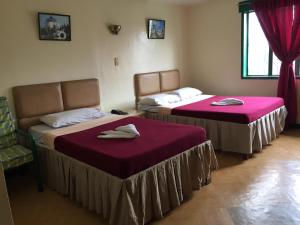 Voodi või voodid majutusasutuse Benguet Prime Hotel toas