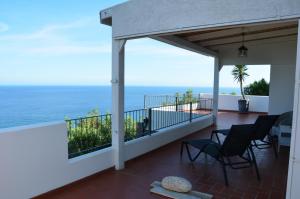 a balcony with a view of the ocean at Villa Ca' Bianca in Finale Ligure