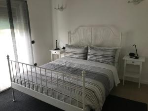 Un pat sau paturi într-o cameră la Residence Alessandra
