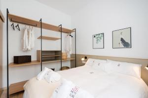 Postel nebo postele na pokoji v ubytování Petit Luxe Ègara