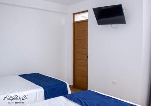Voodi või voodid majutusasutuse Majhu Hostal toas