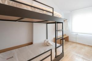 Postel nebo postele na pokoji v ubytování Petit Luxe Ègara