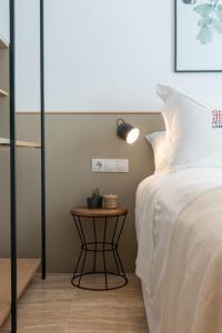 Postel nebo postele na pokoji v ubytování Petit Luxe Ègara