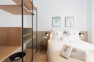 Postel nebo postele na pokoji v ubytování Petit Luxe Ègara