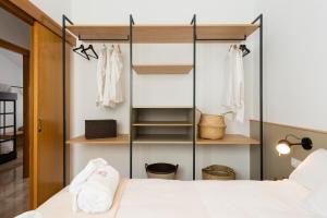 Postel nebo postele na pokoji v ubytování Petit Luxe Ègara